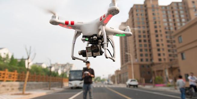 Drone-Flying-City-Street-Human-Pilot.jpg.653x0_q80_crop-smart